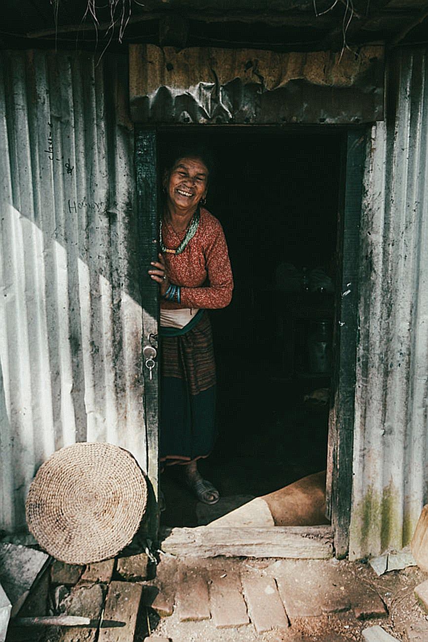 Smiling Woman in Shed Doorway