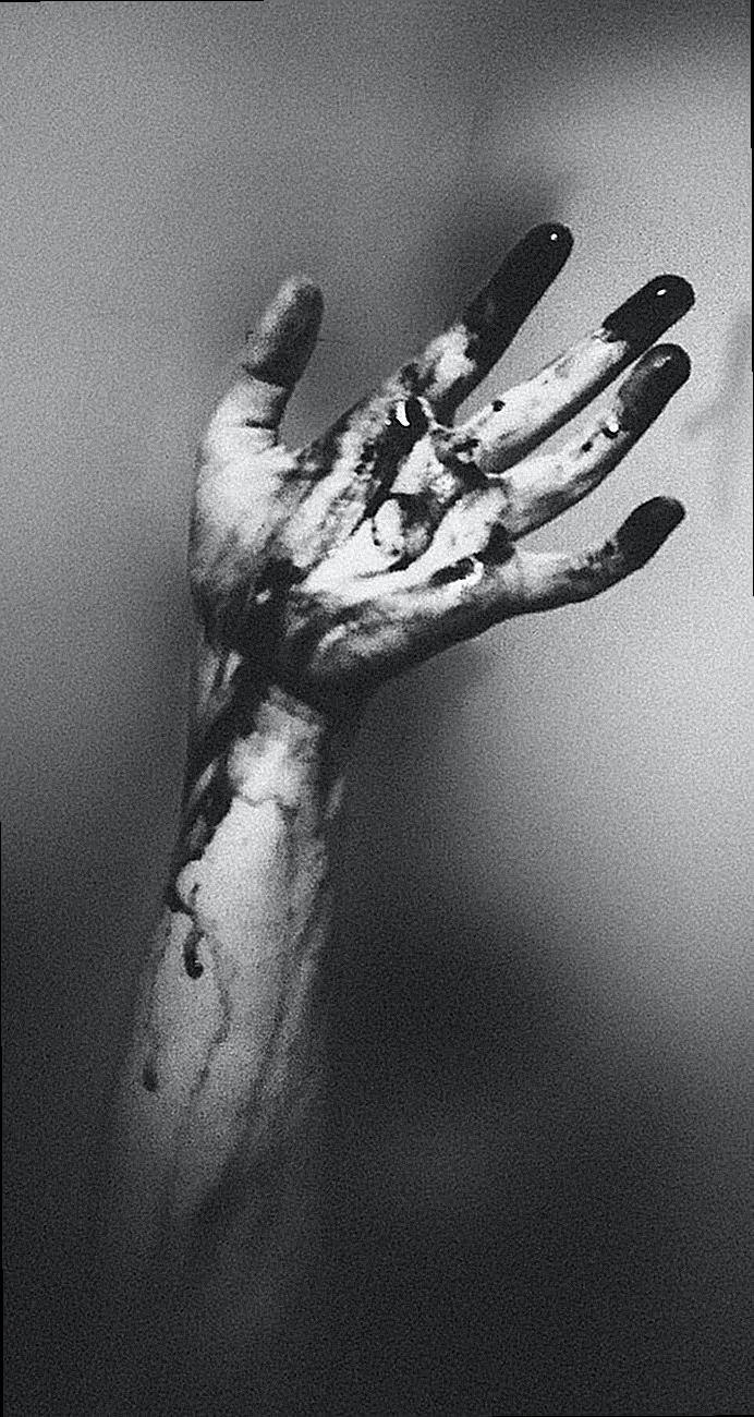 Photo of Hand with Dark Paint